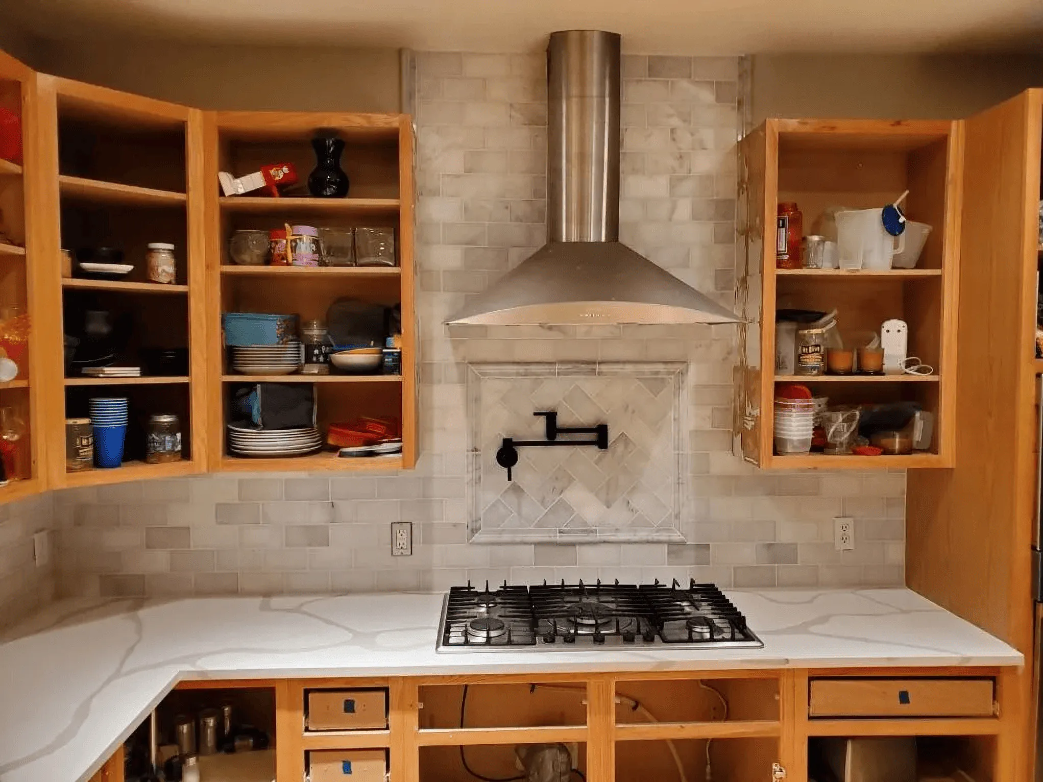 Bright, open-concept kitchen with clean white quartz islands